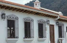 Elegant corne house adorned with traditional colonial balconies