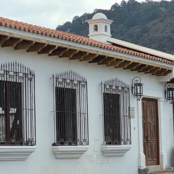 Elegant corne house adorned with traditional colonial balconies