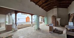 Elegant corner house adorned with traditional colonial balconies